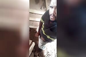 Worker masturbating hidden in construction