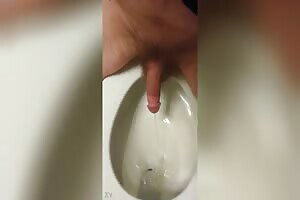 Pissing in toilet backwards