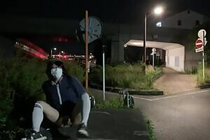 When Mayu, a crossdresser, tried to expose herself on a platform by the side of the road, she was surprised when a car passed by her side.
