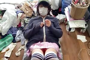 Mayu, a crossdresser in a miniskirt and knee-high socks, spreads her legs wide open at home and feels good with an electric massager