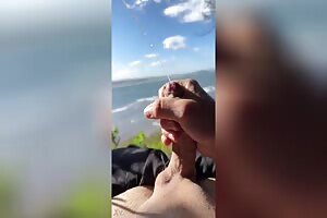 Boy cumming solo at beach slowmotion