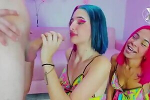 two beautiful girls with colorful hair fuck his throat